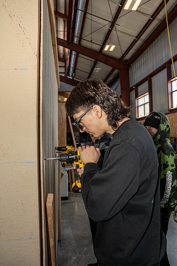Student working on wall